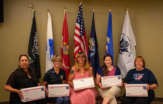 staff senate members with shipping boxes