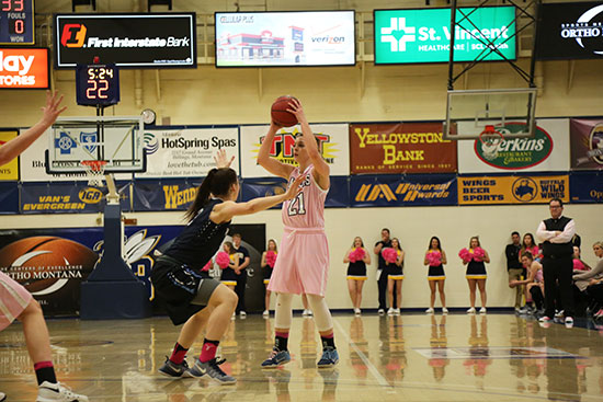 Lady Yellowjackets during a Pink Night basketball game