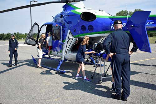 campers look over the St. Vincent Healthcare Help Flight helicopter