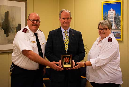Captains Donald and Kim Warriner of the Salvation Army presented an appreciation plaque to Chancellor Dan Edelman