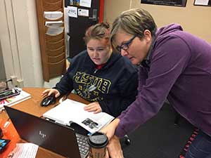 Academic Coordinator, Tracie Musso, helping a student