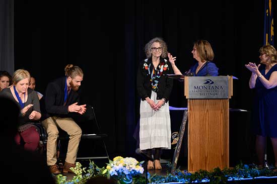 Dr. Fishbaugh receiving her award