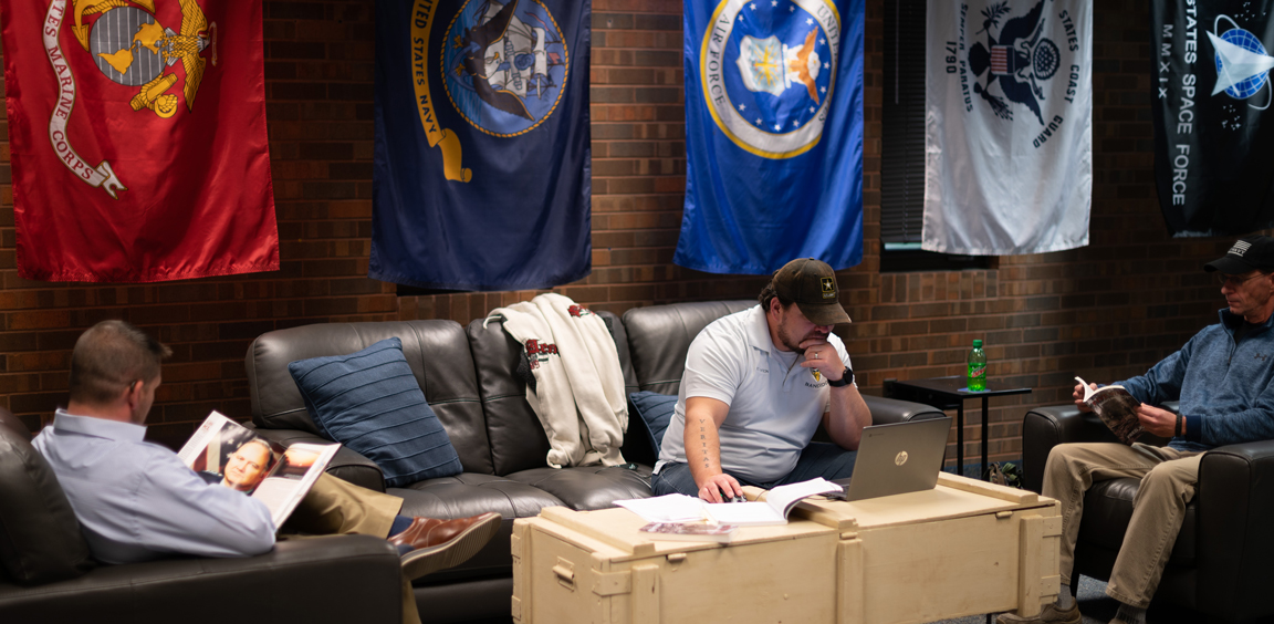 veterans studying in college lounge